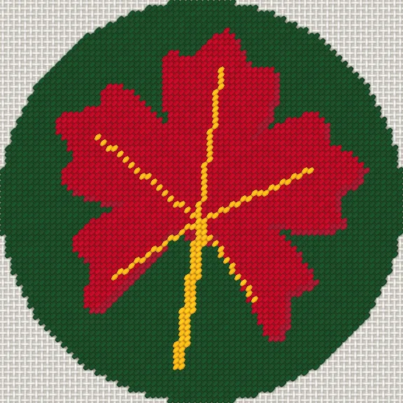 Round ornament with a red maple leaf on green